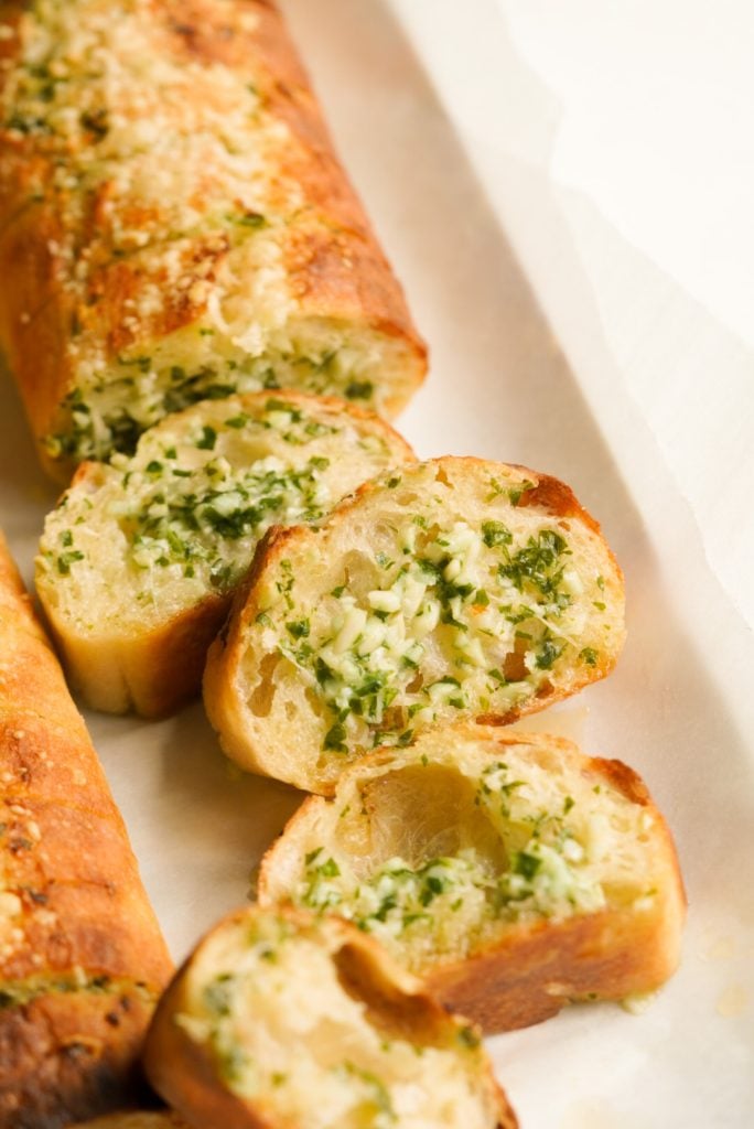 serving platter of pull apart garlic bread made with french baguette.
