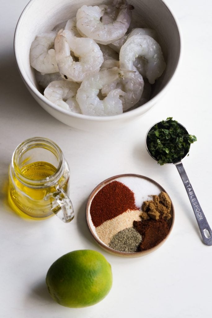ingredients needed to make baja shrimp measured out on a white table.