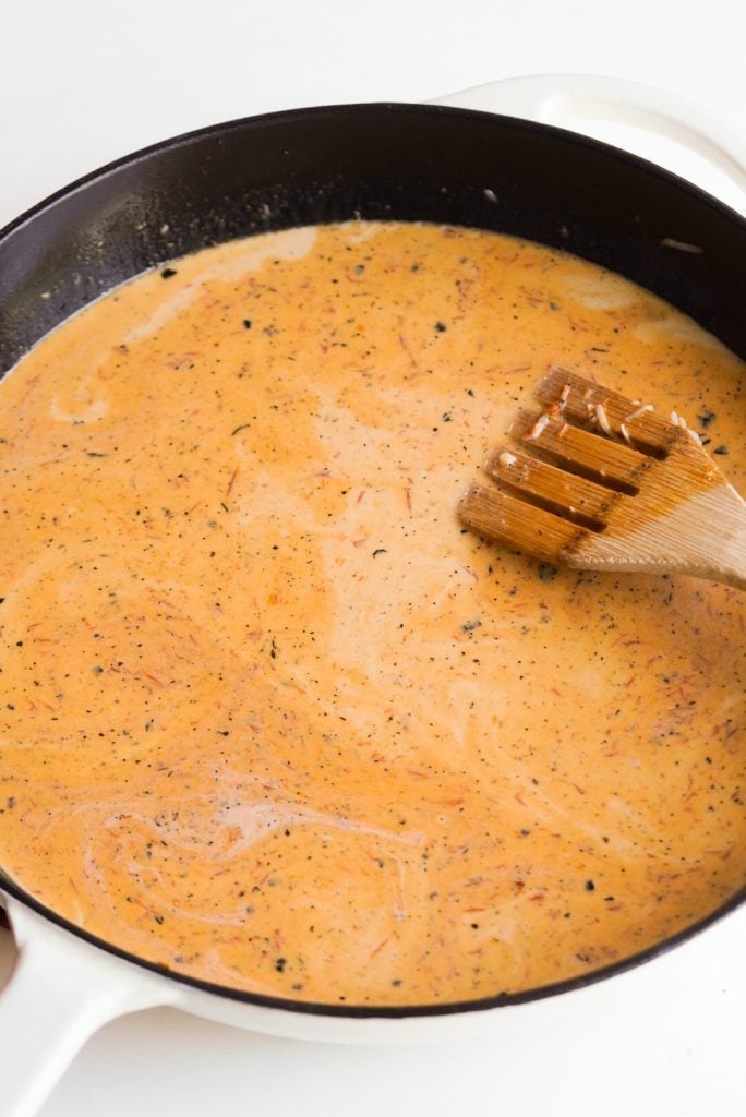 creamy sundried tomato pasta sauce in a skillet.