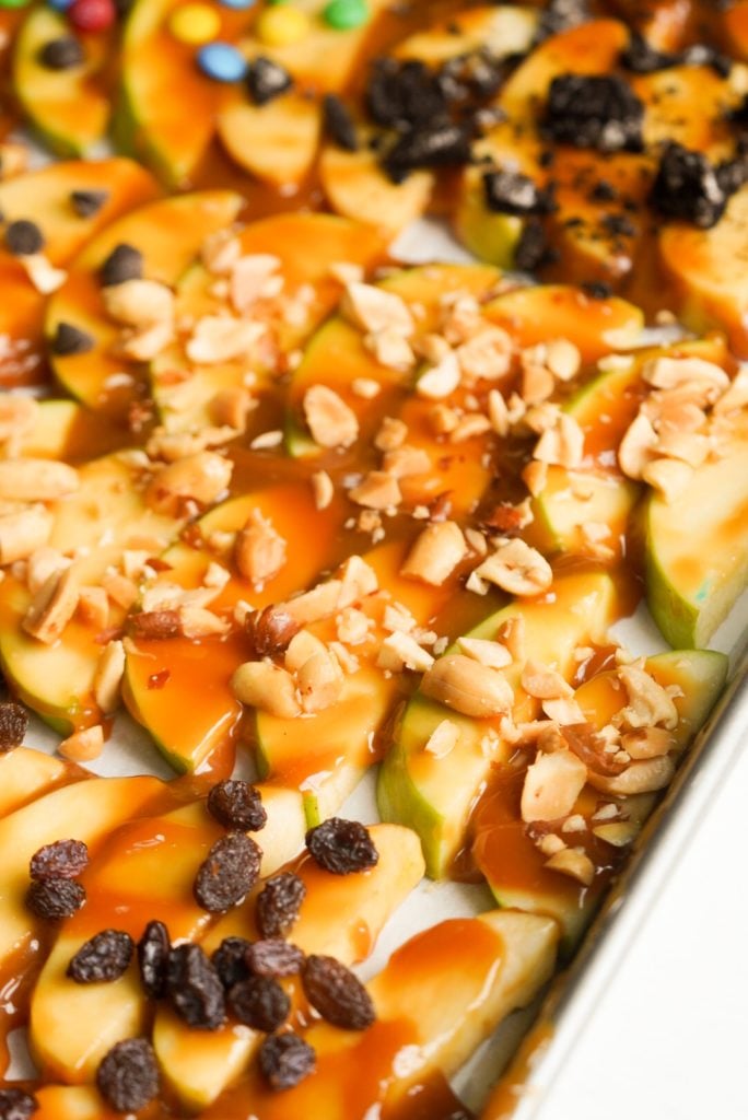 caramel apple slices with chopped peanuts