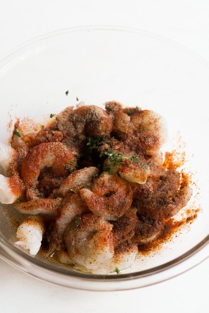 raw shrimp in a bowl with baja spices added.