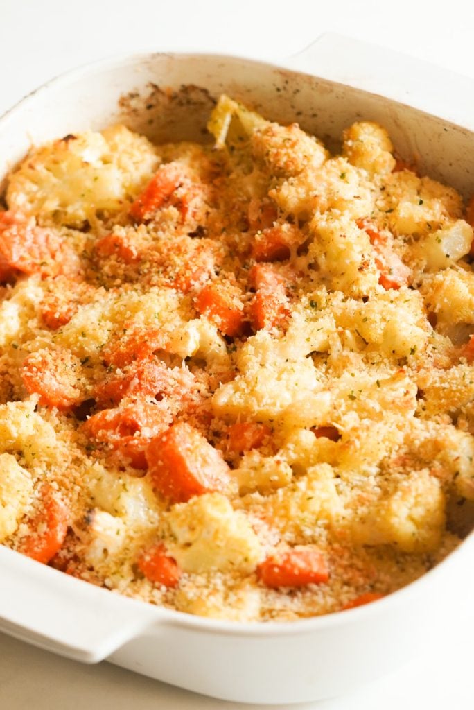 roasted carrots and cauliflower after the second bake — the parmesan cheese has melted and caused the panko to adhere to the top of the veggies.