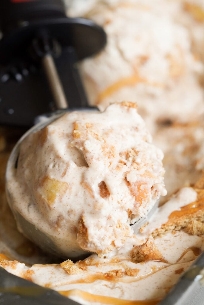 super closeup shot of a scoop of caramel apple crisp ice cream.