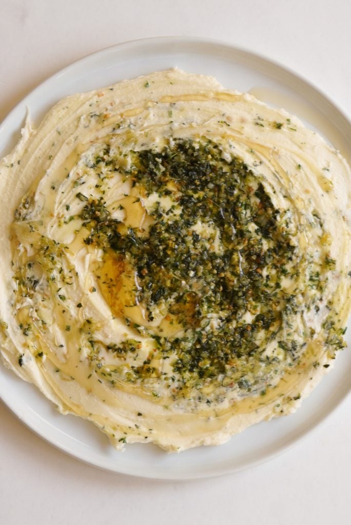 brie spread topped with honey, garlic, and herbs