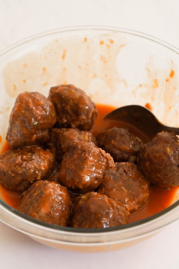 process shot - baked beef meatballs tossed with firecracker sauce.