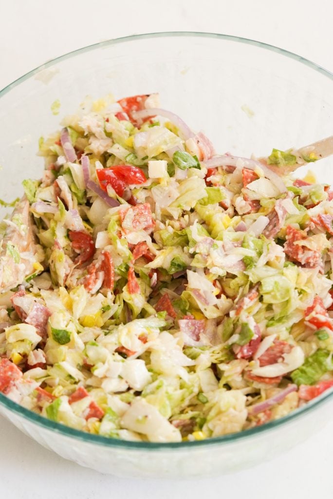 dressed creamy chopped sub salad in a mixing bowl