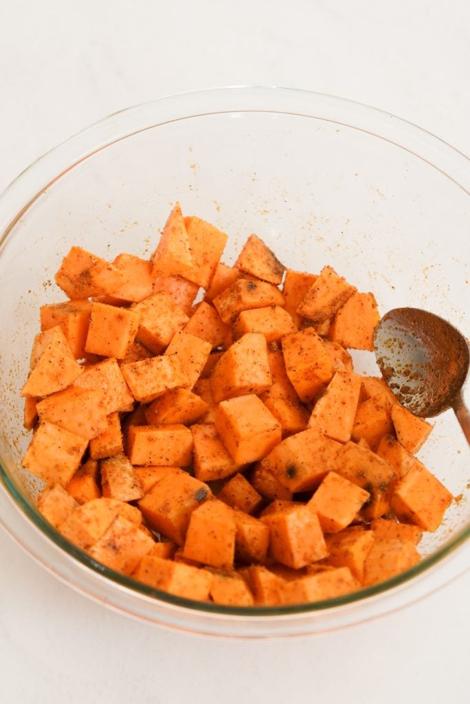 sweet potato cubes mixed with oil and seasonings