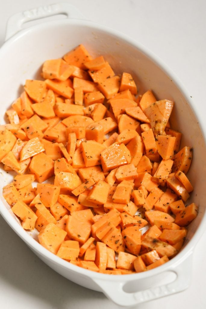 sweet potatoes in a large baking dish before baking