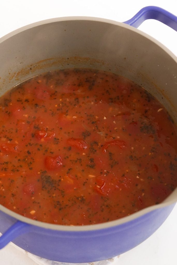 tomato soup simmering before blending to a smooth purée.