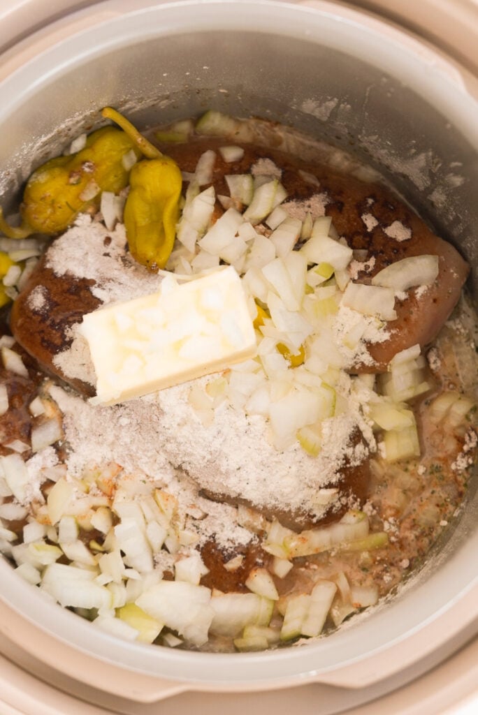 Mississippi chicken ingredients in a slow cooker