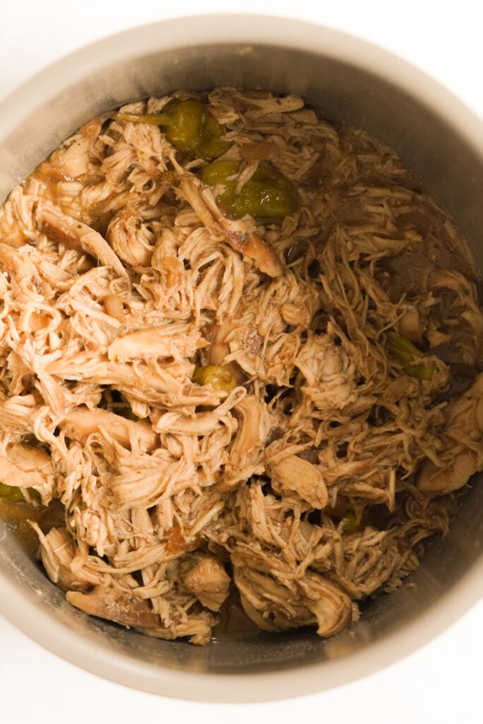 shredded chicken in a slow cooker

