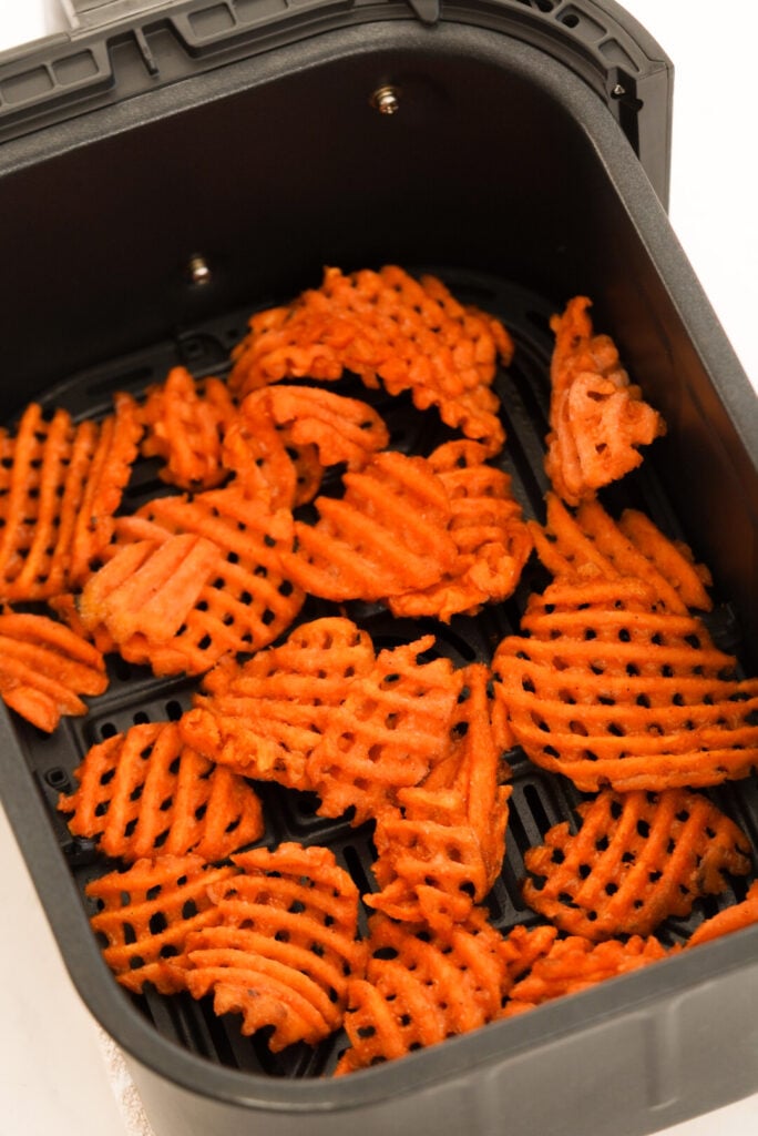 Frozen sweet potato waffle fries in the air fryer before cooking