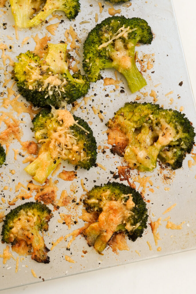 baking sheet with parmesan smashed broccoli.