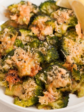 smashed broccoli parmesan in a bowl.