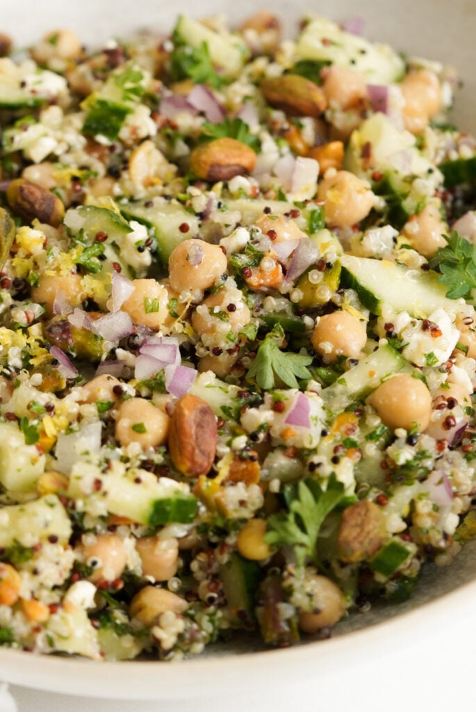 Quinoa salad with chickpeas, feta cheese, pistachios, red onion, and fresh herbs