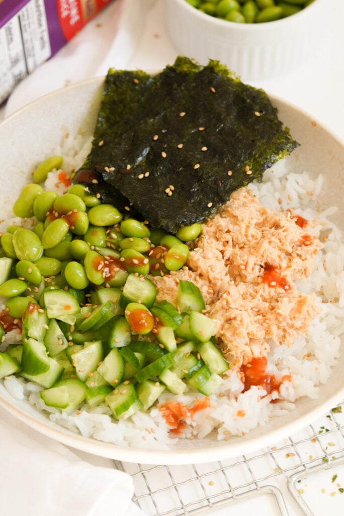 tuna rice bowl with cucumber, edamame, and seaweed