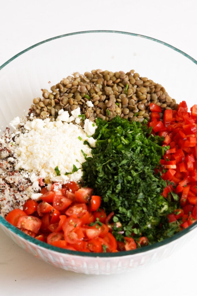 quinoa salad ingredients in a mixing bowl