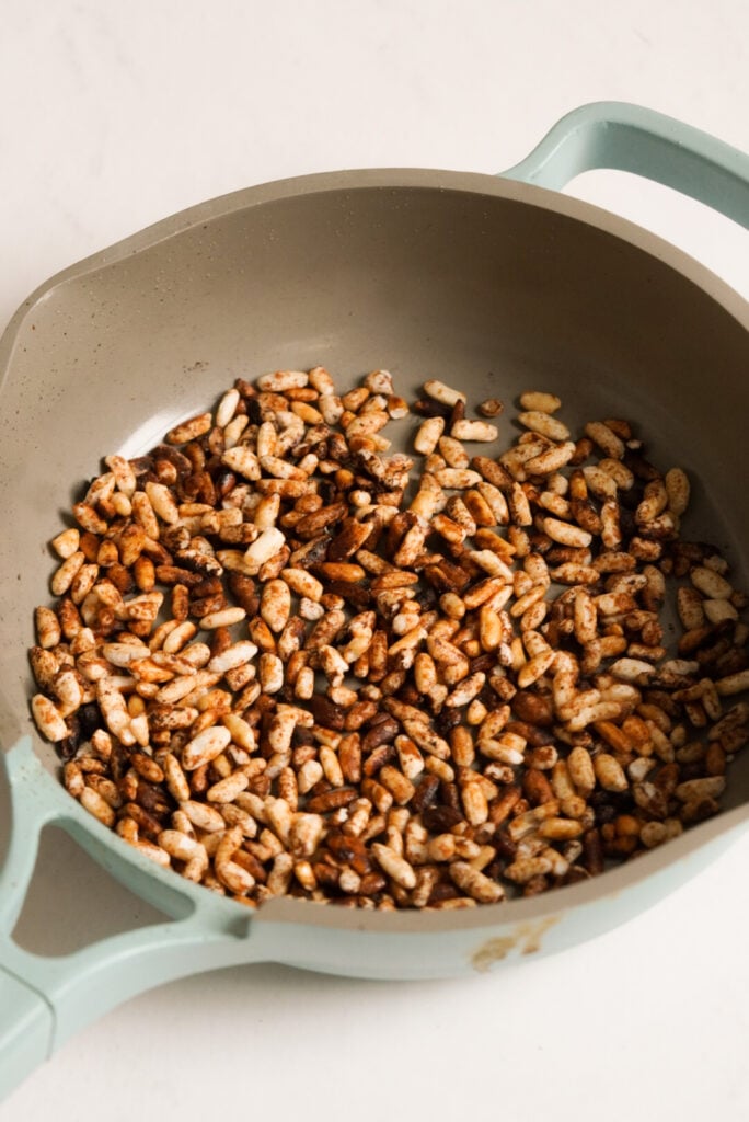 crispy rice cooking in a small pan