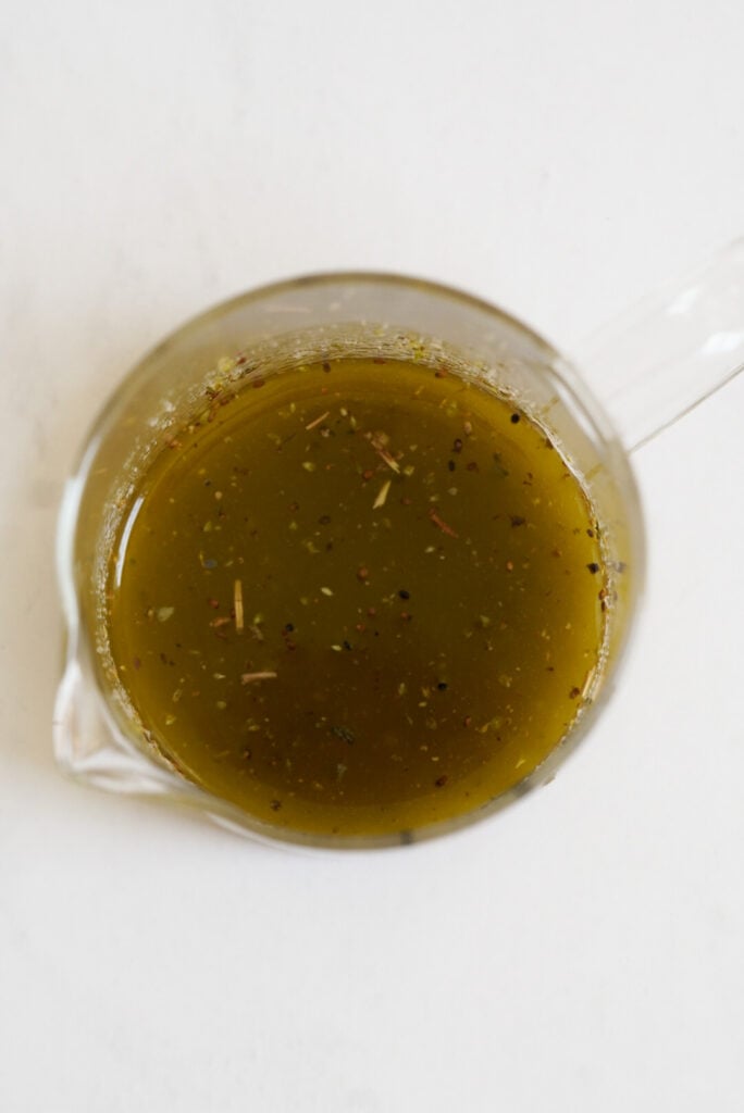 italian vinaigrette in a measuring cup after mixing.