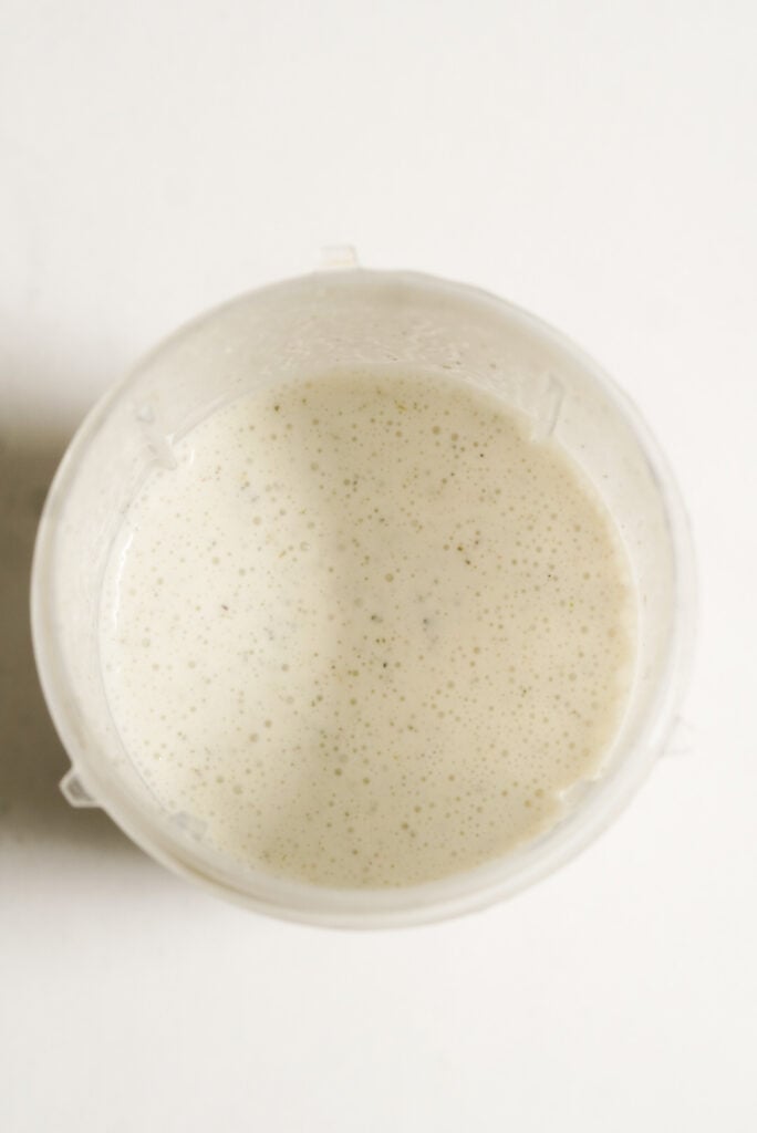 alfredo sauce mixture in a blender after blitzing until smooth and creamy.