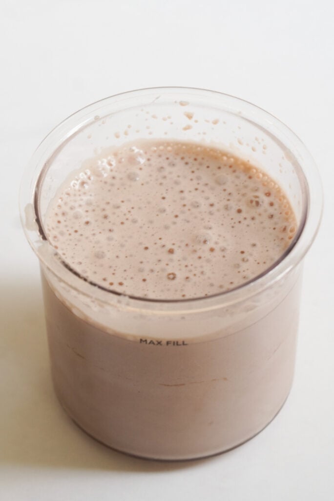 milk and protein powder mixed together in the ninja creami pint container