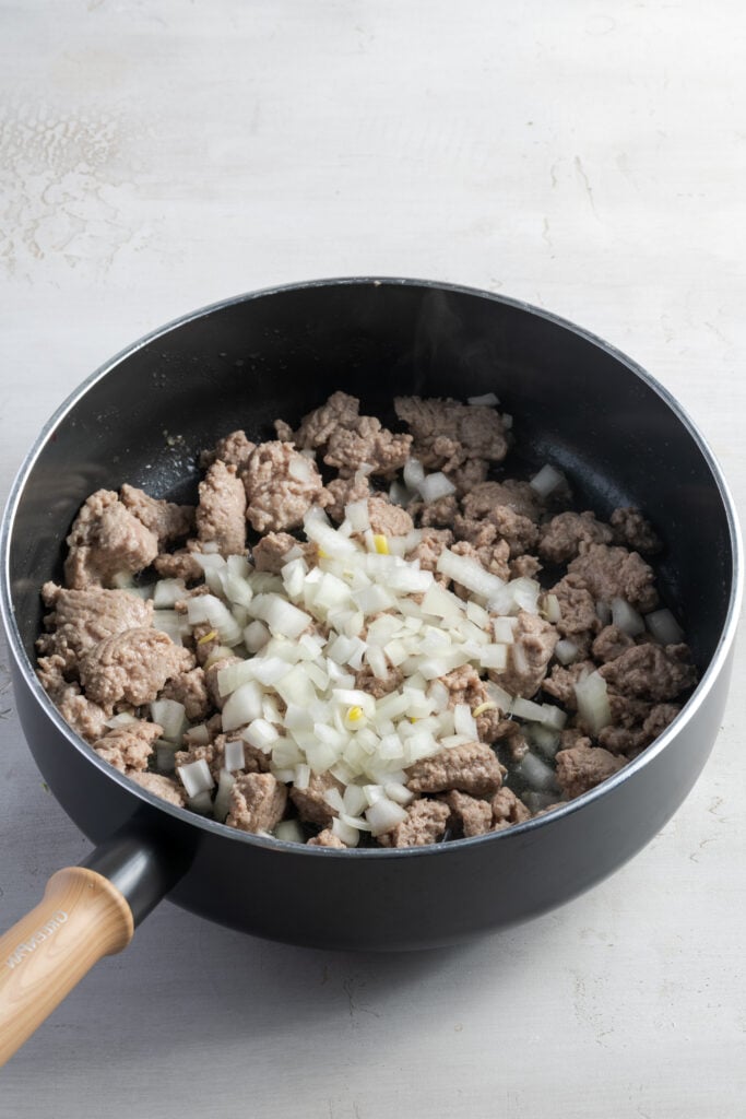 onions added to the skillet with the browned turkey meat.