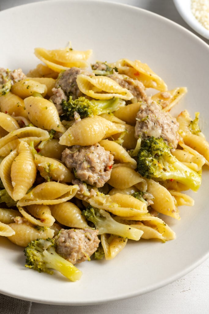 plate of ground turkey broccoli pasta dinner before garnishing with cheese.