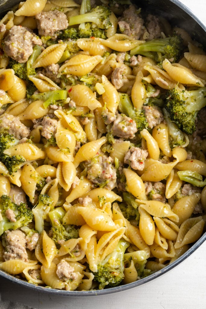 overhead shot of ground turkey pasta with bacon after mixing together in the skillet.