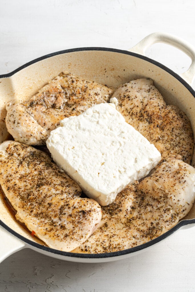 feta cube added to the middle of the skillet with the browned chicken breasts.