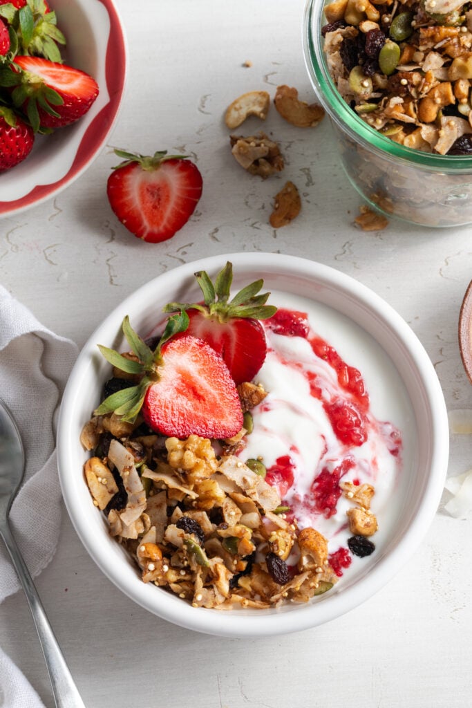 grain free granola yogurt bowl with strawberries.