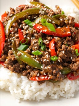closeup shot of a ground beef and pepper rice bowl showing the saucy meat and pepper mixture.