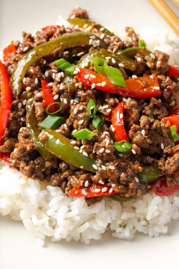 closeup shot of a ground beef and pepper rice bowl showing the saucy meat and pepper mixture.