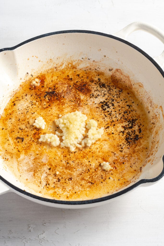 minced garlic added to the skillet with the chicken fond.