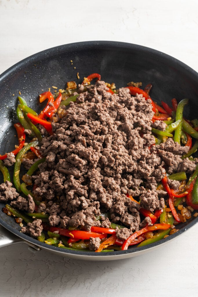 browned ground beef added to the veggie mixture.