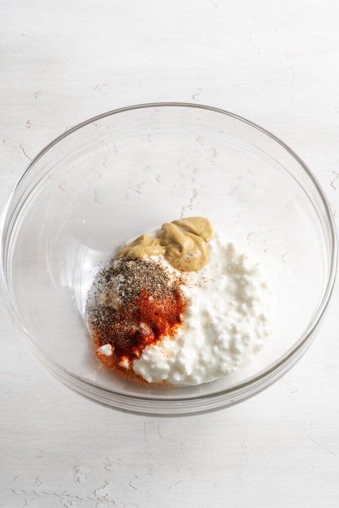 cottage cheese egg salad dressing ingredients in a bowl before mixing.