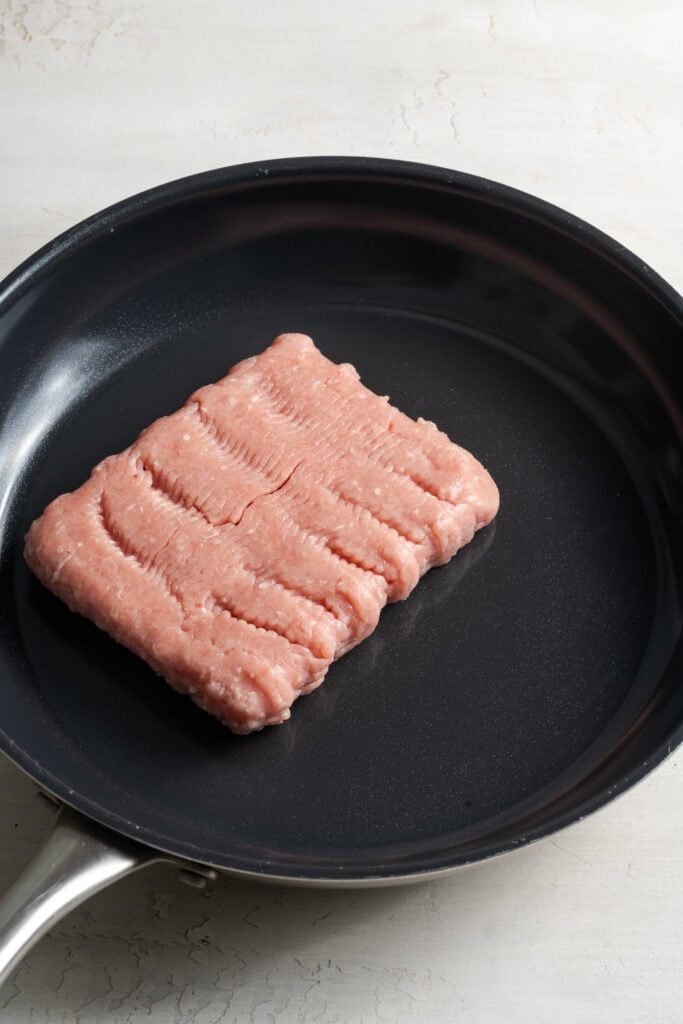 ground turkey cooking in a skillet.