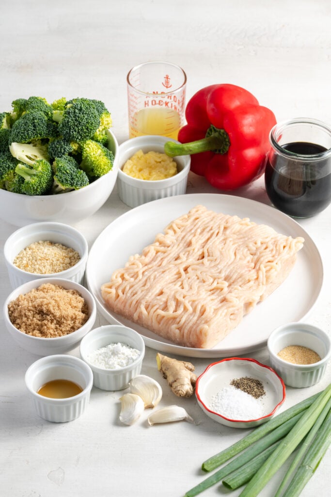 ingredients needed to make pineapple teriyaki chicken meatballs recipe measured out on a white table.