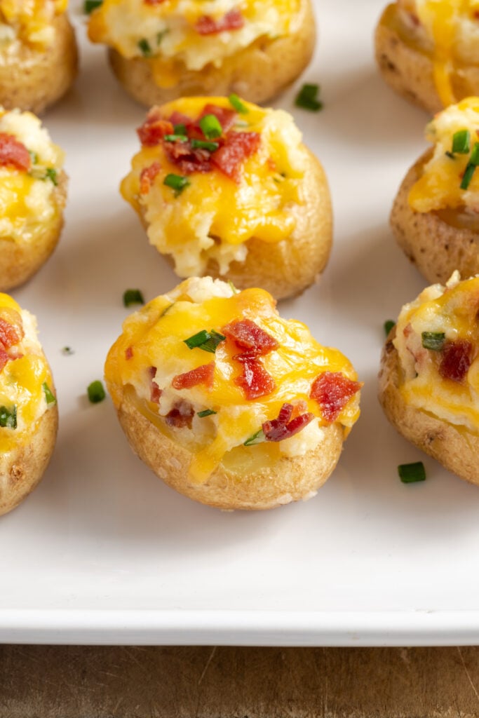 mini baby baked potatoes appetizer with bacon and cheese.