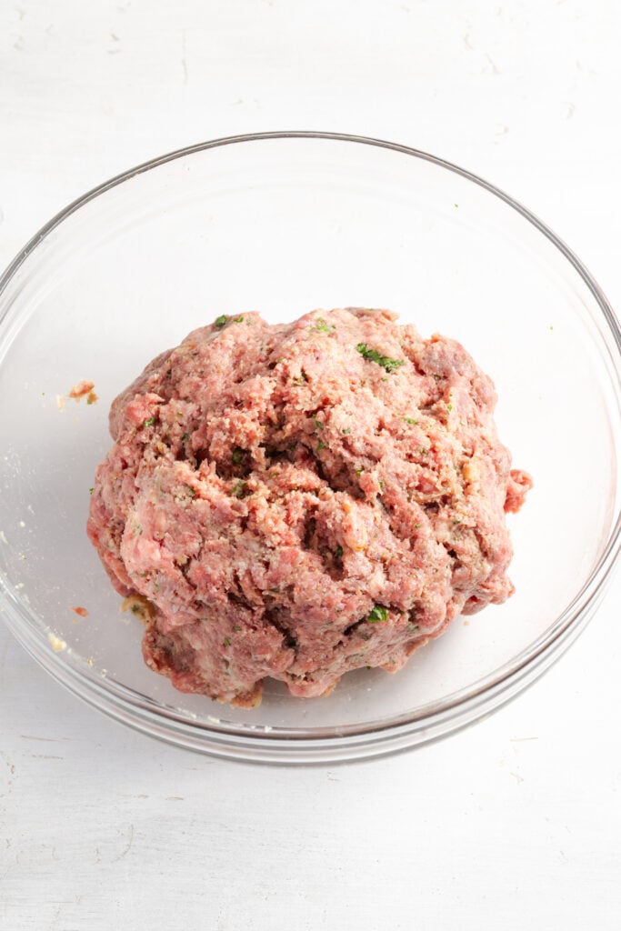 ground beef french onion meatball mixture in a mixing bowl.