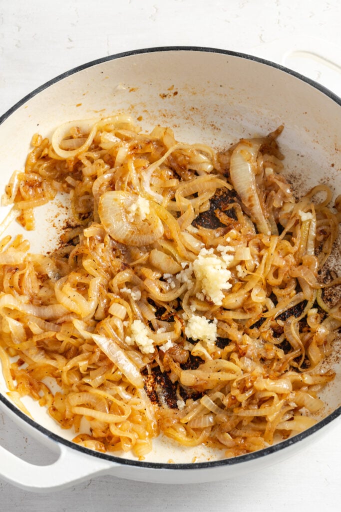 more garlic added to the pan with the golden sauteed onions as they cook.