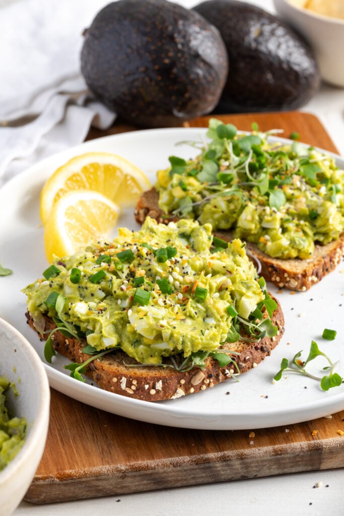 avocado egg salad on multigrain toast topped with everything but the bagel seasoning and microgreens.