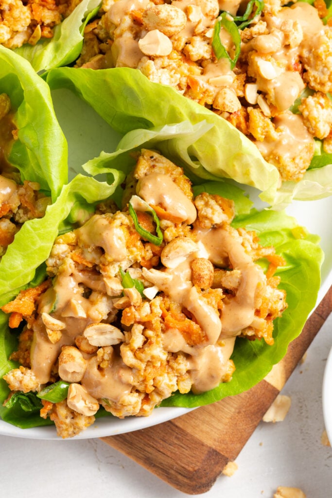 closeup overhead shot of ground turkey Asian lettuce wraps with peanut sauce.