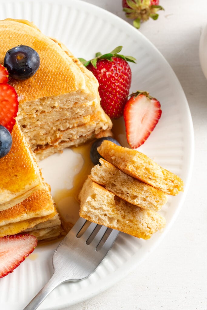 bite of cottage cheese pancakes on a fork.