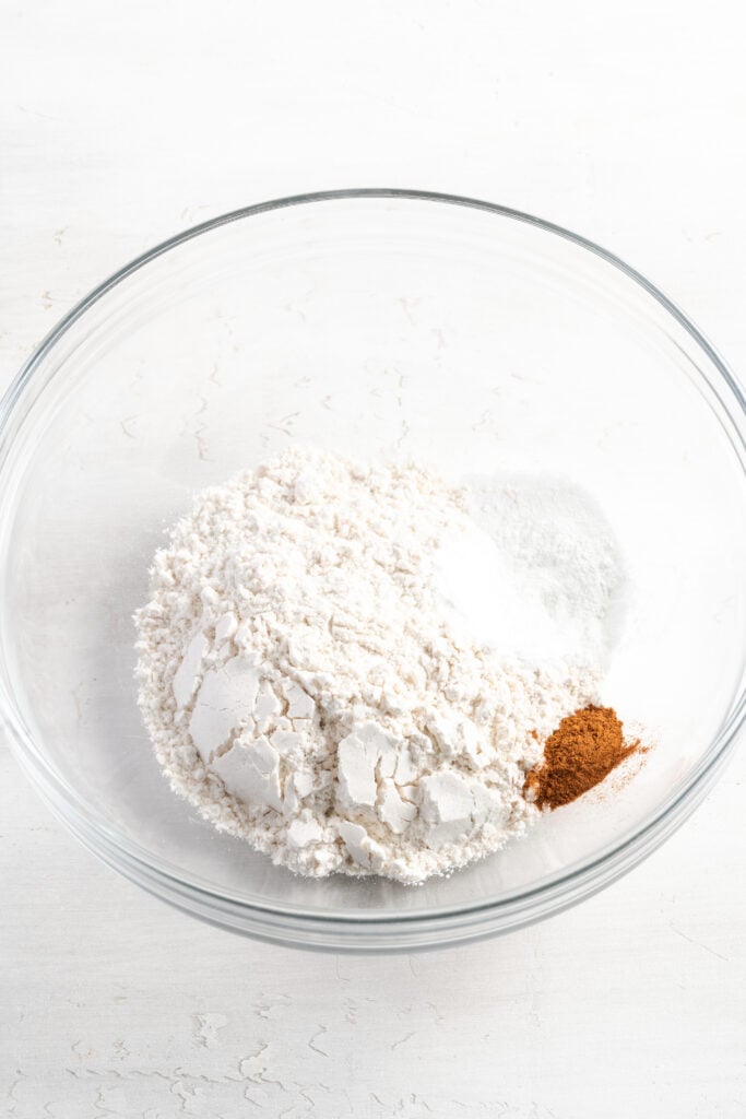 dry pancake ingredients added to a mixing bowl.