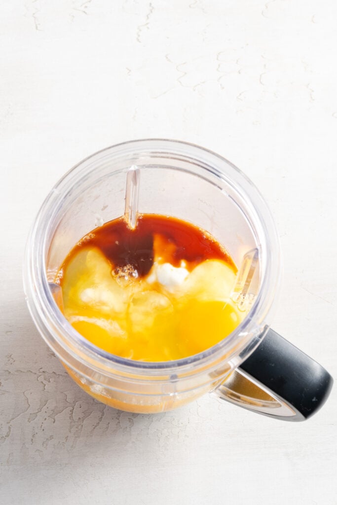 cottage cheese, eggs, and vanilla in a blender pitcher.