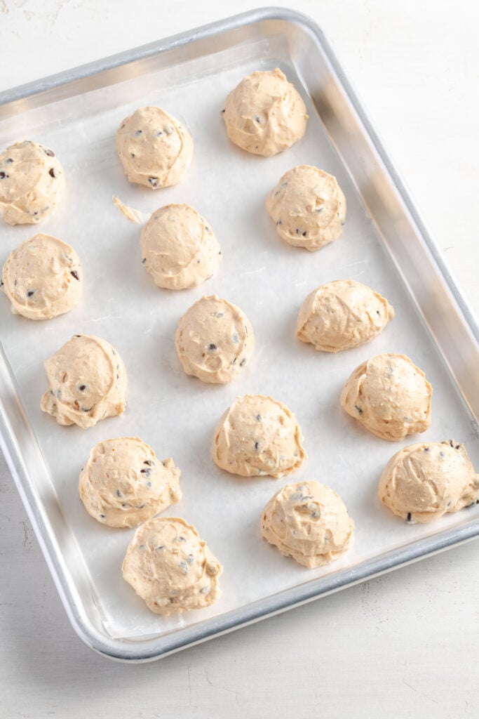 cookie tray filled with frozen yogurt peanut butter balls.