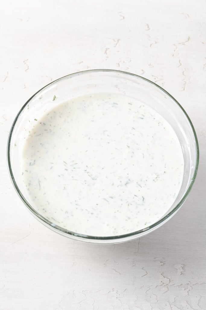 dill pickle dip with cottage cheese and greek yogurt after whisking together.