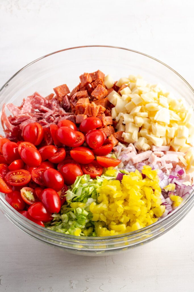 veggies, meats and cheeses added to the bowl with the cooked pasta before adding the dressing and tossing.