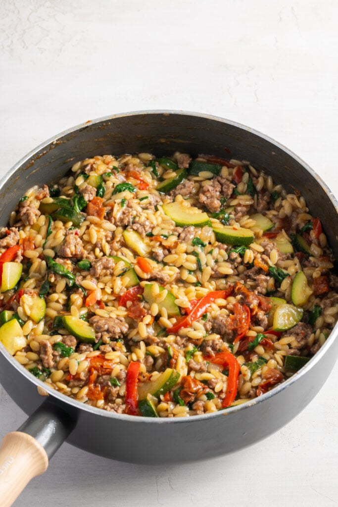cooked ground beef and orzo skillet before adding all the fresh toppings.