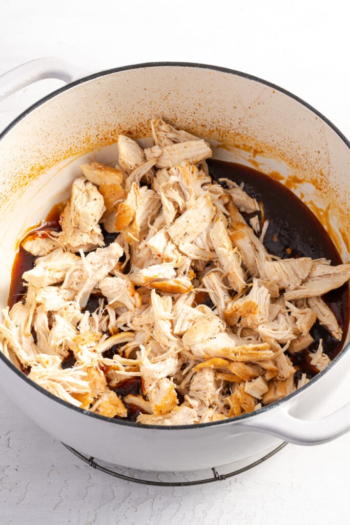 shredded chicken added to the sticky sesame sauce after it was reduced.